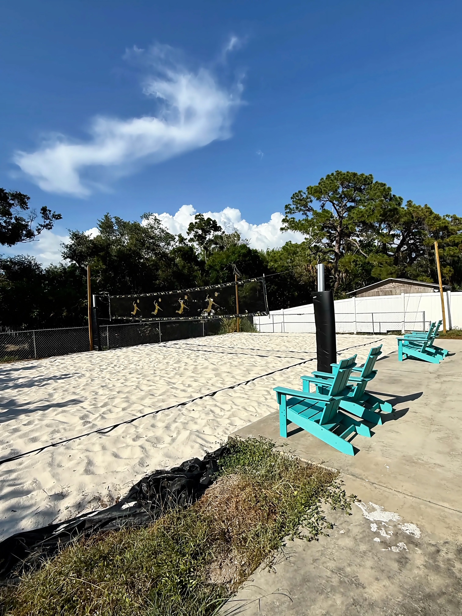 Sand volleyball court with courtside seating