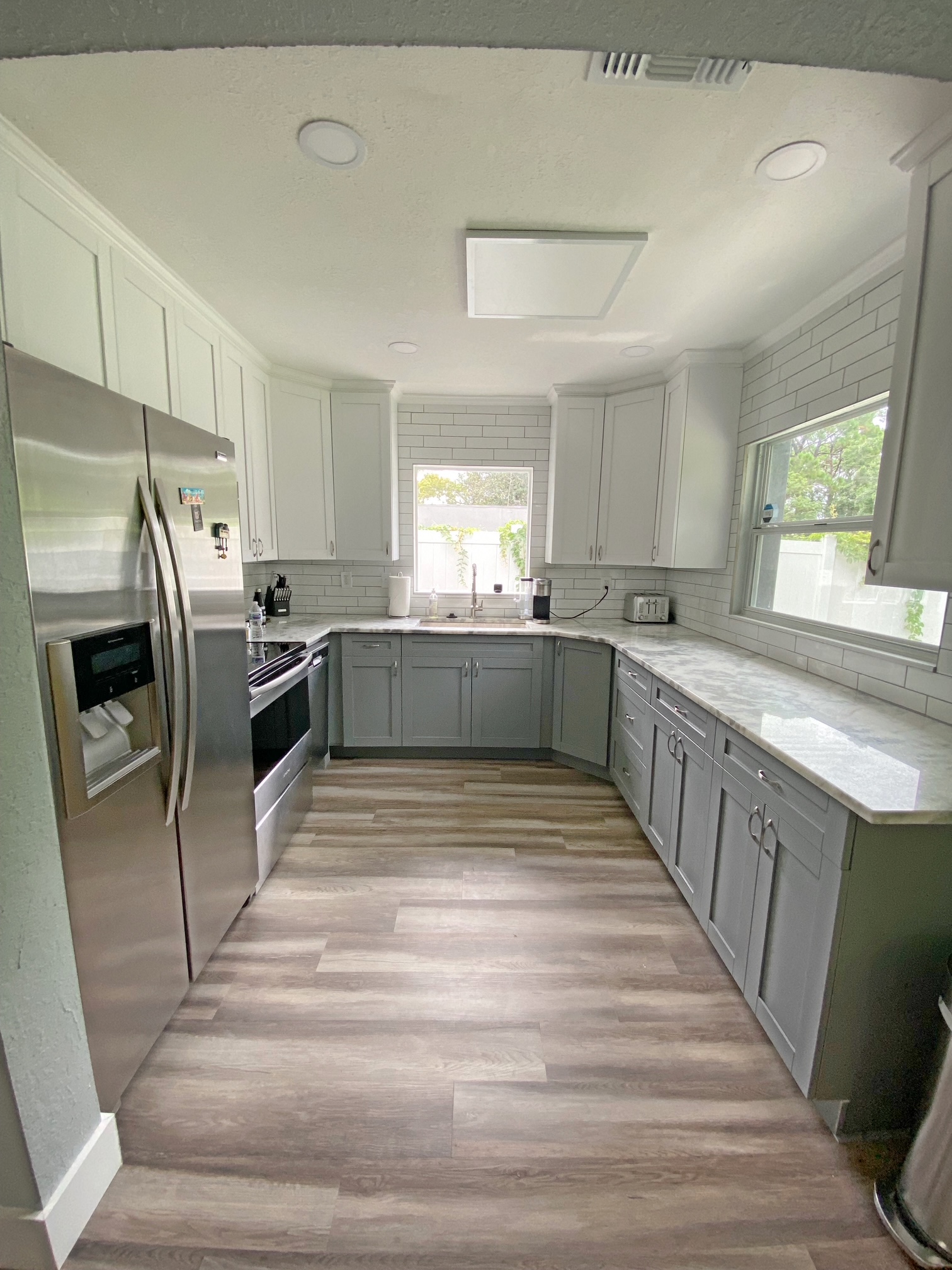 Remodeled kitchen with marble-look counters
